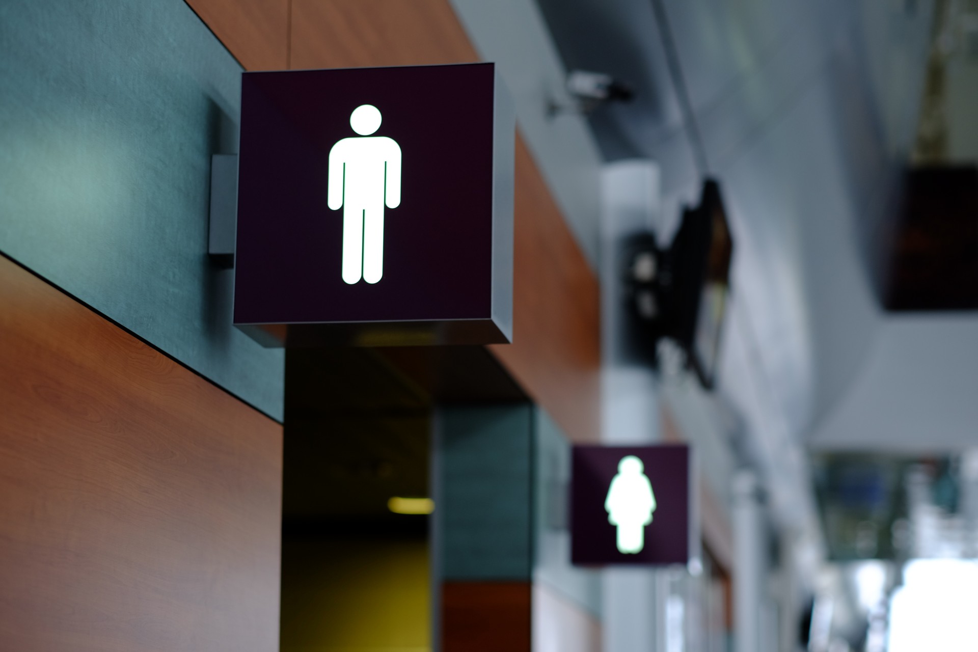 entrance to the male and female toilet. Sign in airport